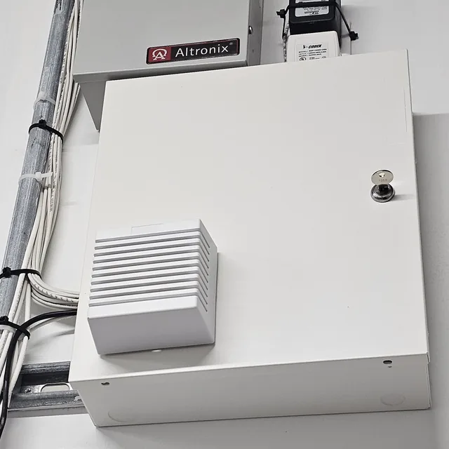Closed alarm panel enclosure with siren, Altronix power supply and transformer, Clermont, FL