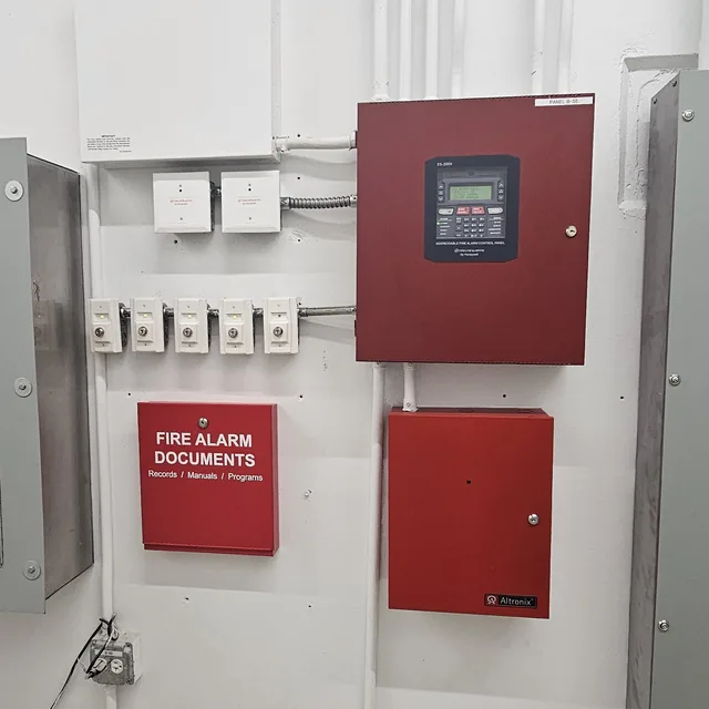 Commercial fire alarm control panel, power supply, relay modules and document cabinet installed with conduit, Winter Garden, FL