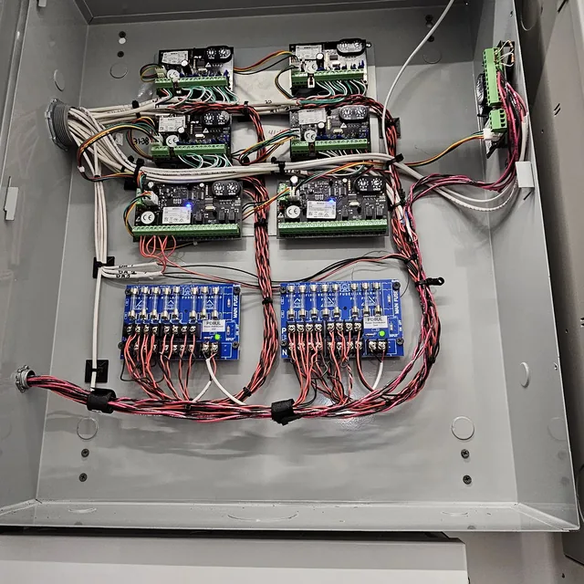 Enclosure with low-voltage power supplies, relay modules and power distribution boards wired to Cat6 cabling, Kissimmee, FL