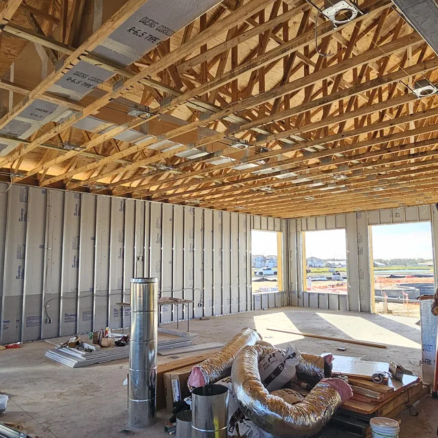 New construction clubhouse interior with open trusses during low-voltage prewire, Winter Haven, FL