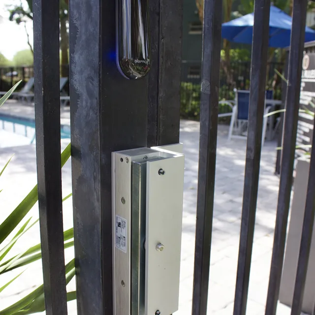Community pool gate with magnetic lock and CDVI proximity reader installed